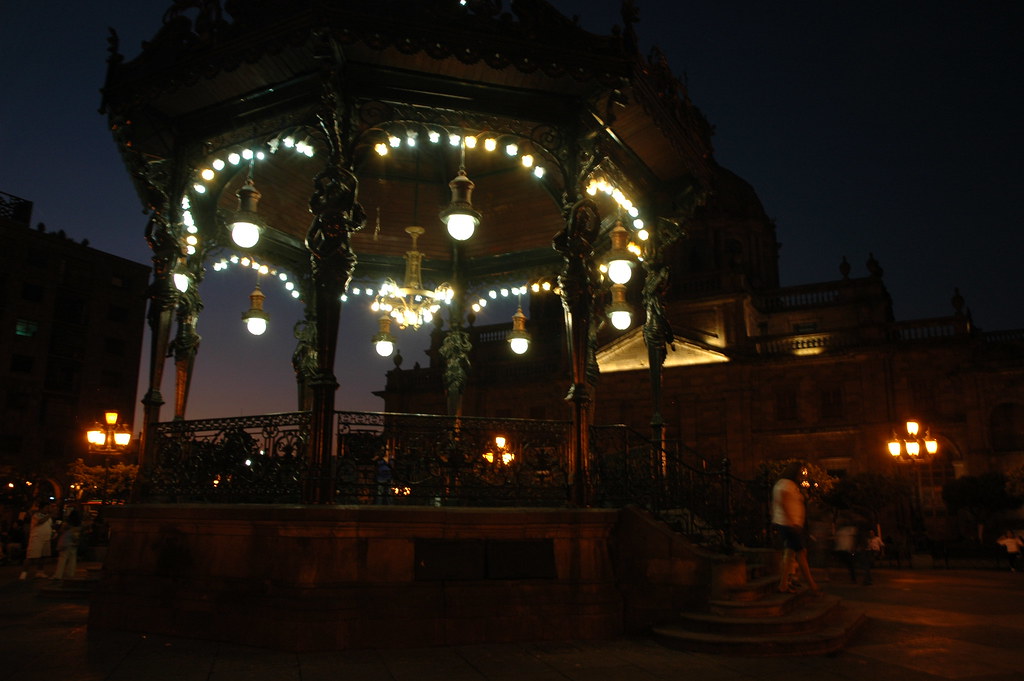 At the center of Guadalajara is a wood and metal gazebo supported…