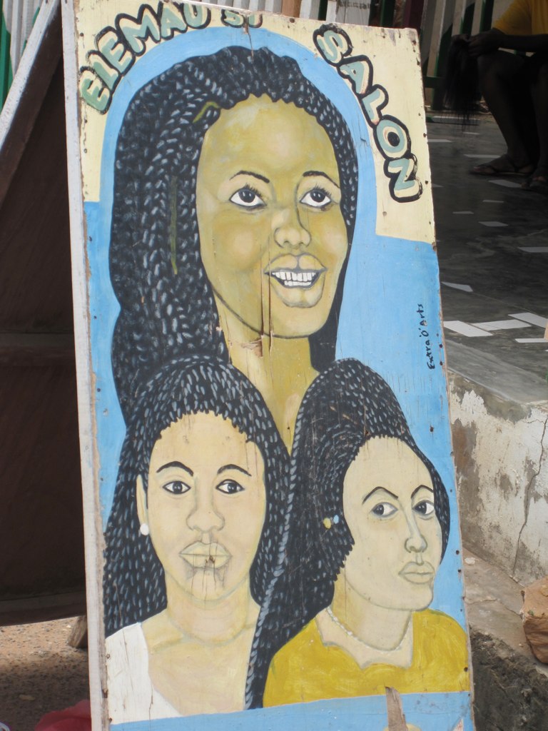 all the beauty salons and barber shops have hand painted signs
