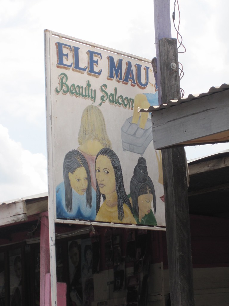 all the beauty salons and barber shops have hand painted signs