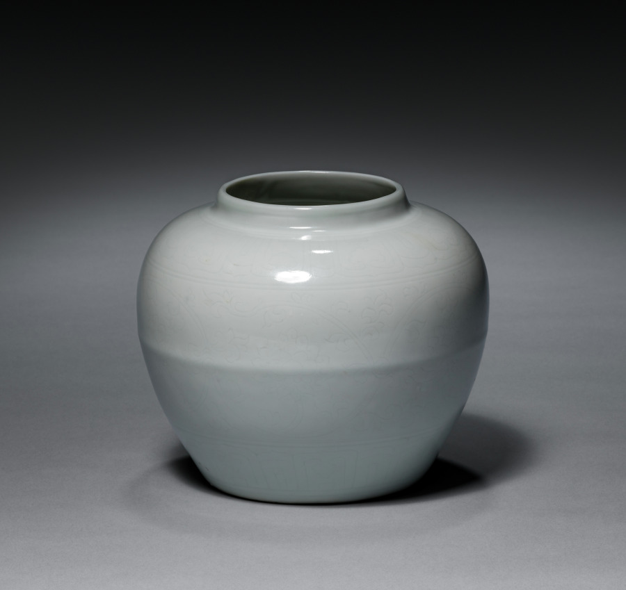 white-glazed jar with hidden design