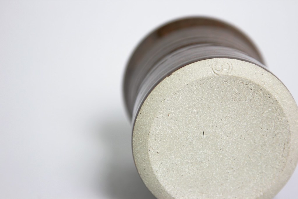 australian studio pottery cup with incised s on back