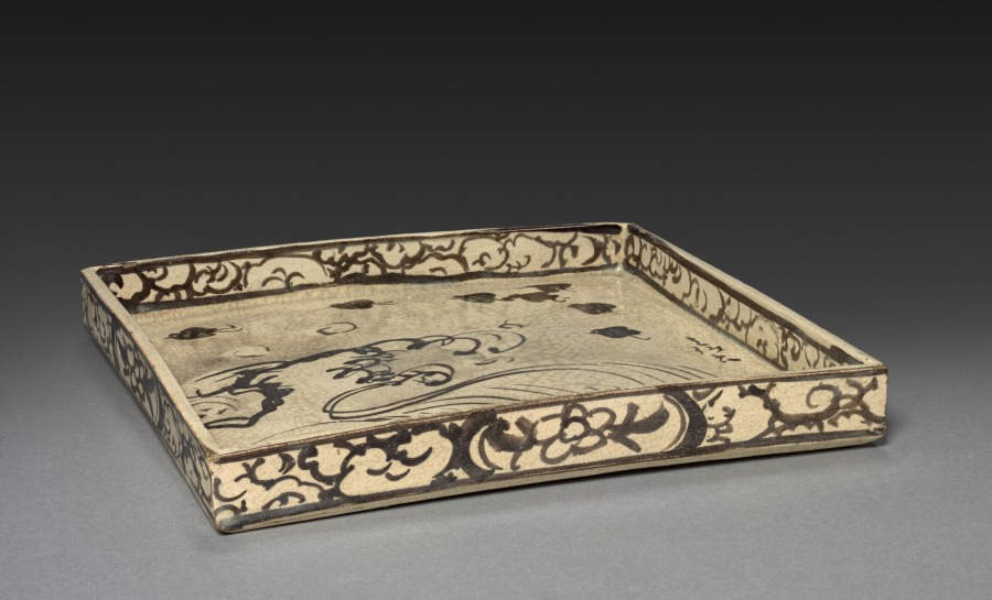 square dish with design of plovers over waves